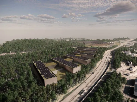Aerial visualisation of a data centre complex surrounded by green landscape
